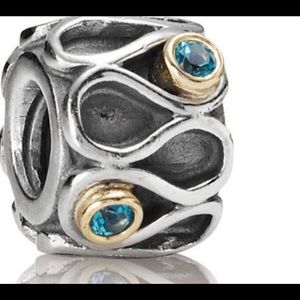 PANDORA Infinity silver & 14k charm with Blue Topaz stones 790366